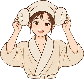 女生把毛巾折成羊角頭戴在頭上,笑得很開心